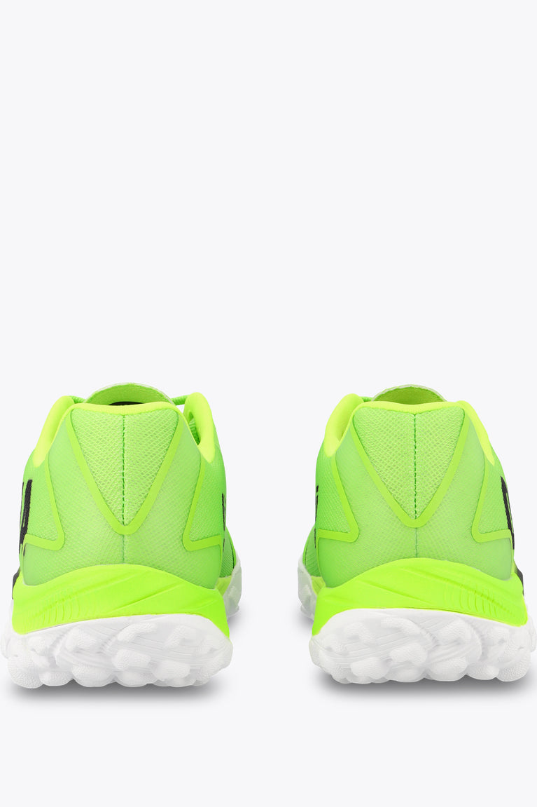 Neon lime sneakers, rear view with pull-tab and white tread sole