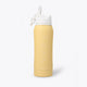 Osaka Kuro aluminium water bottle in faded yellow with logo in white. Back view