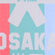 Osaka beach towel in red, green and blue with logo in grey. Detail logo view
