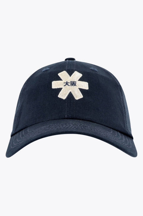 Osaka baseball cap in navy with logo in white. Side view