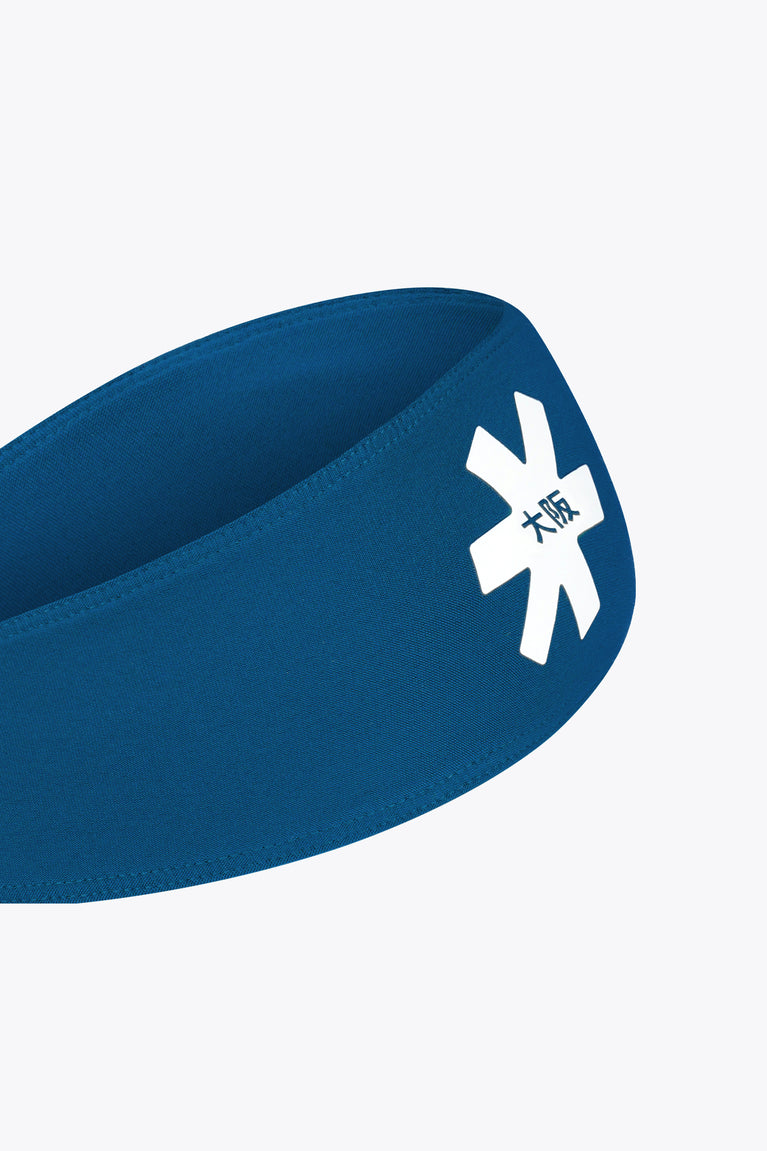 Blue sports bandana close-up with white emblem patch