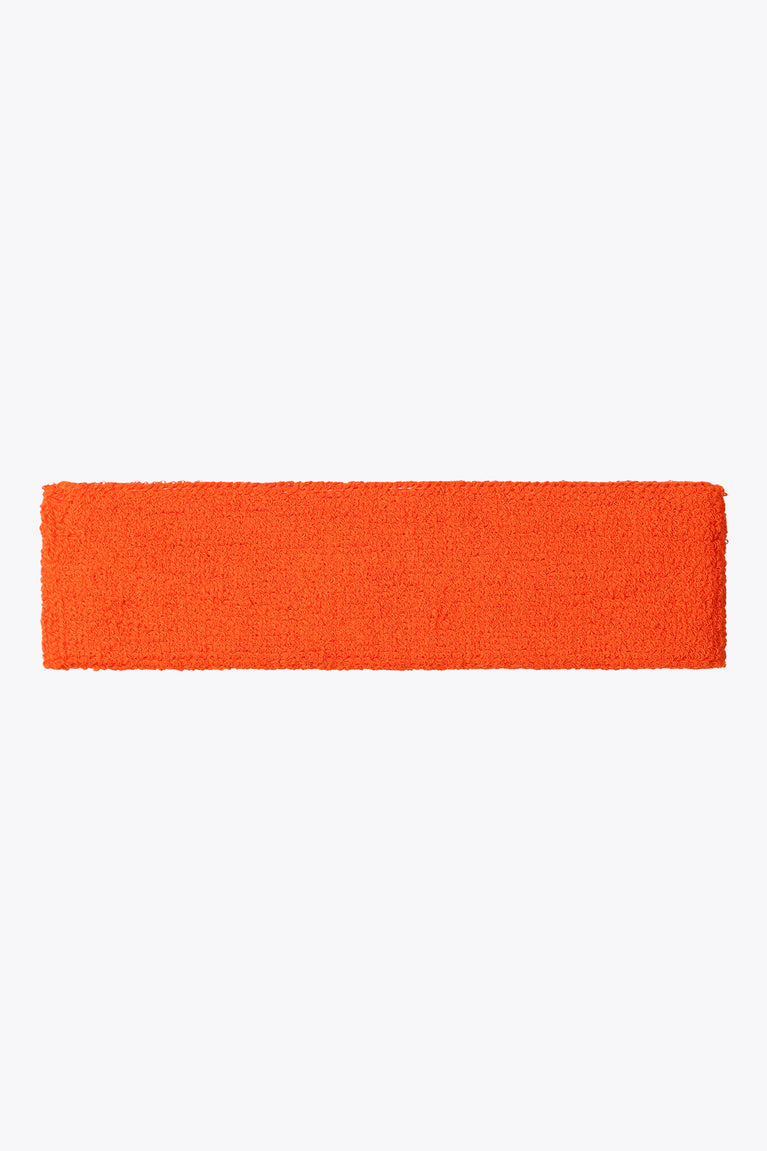 Orange sweatband with solid terry cloth texture