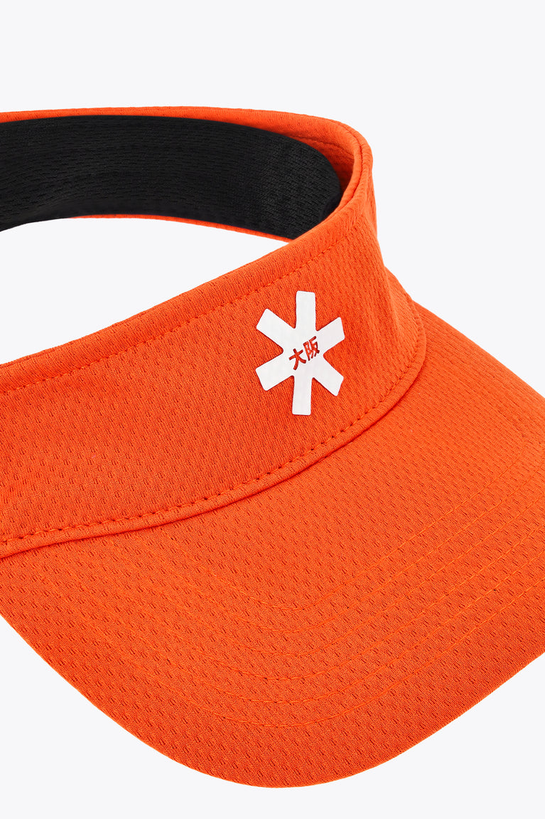 Orange visor close-up with white snowflake logo on front