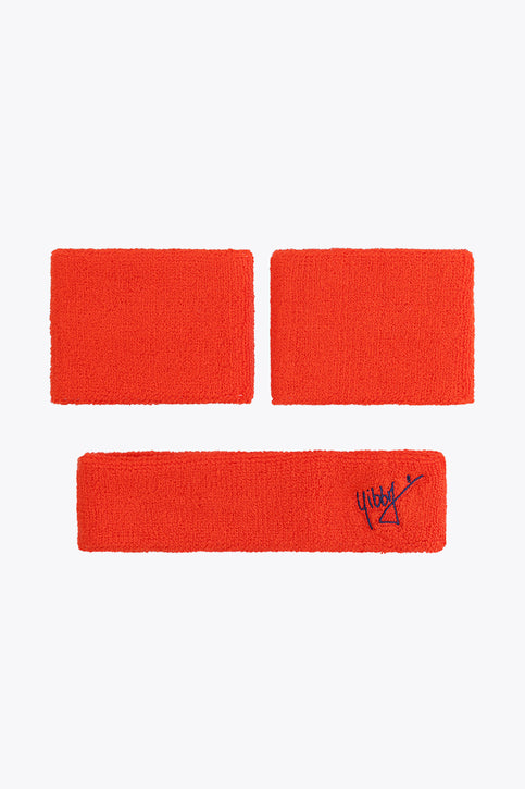 Bright orange sweatband set with blue bow-style logos on three terry straps