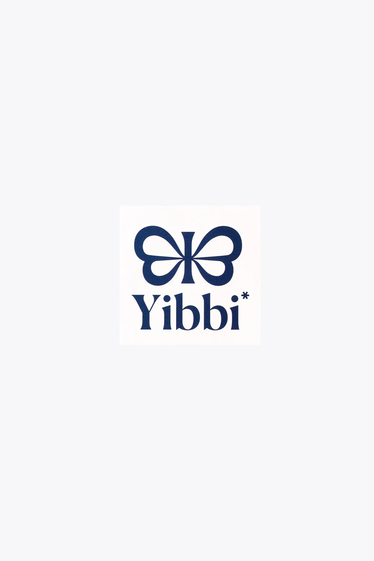 Blue clover bow and Yibbi text tattoo on white square