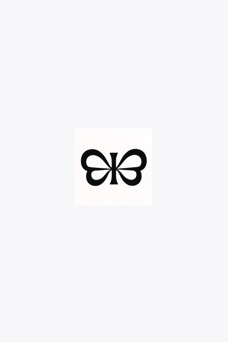 Black clover bow tattoo on white square