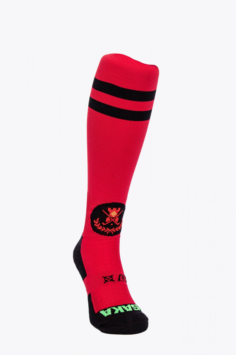 Castelldefels Field Hockey Socks in red with Osaka logo in green. Front view