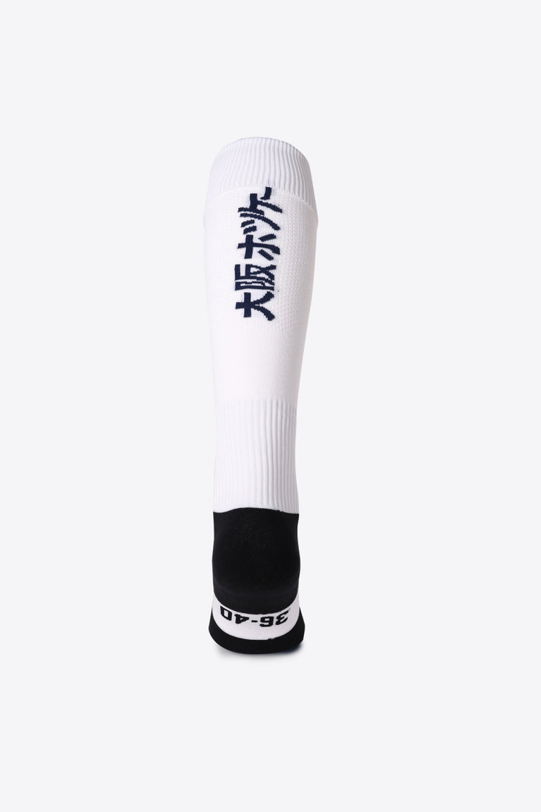 Herakles Field Hockey Socks in white with Osaka logo in green. Back view