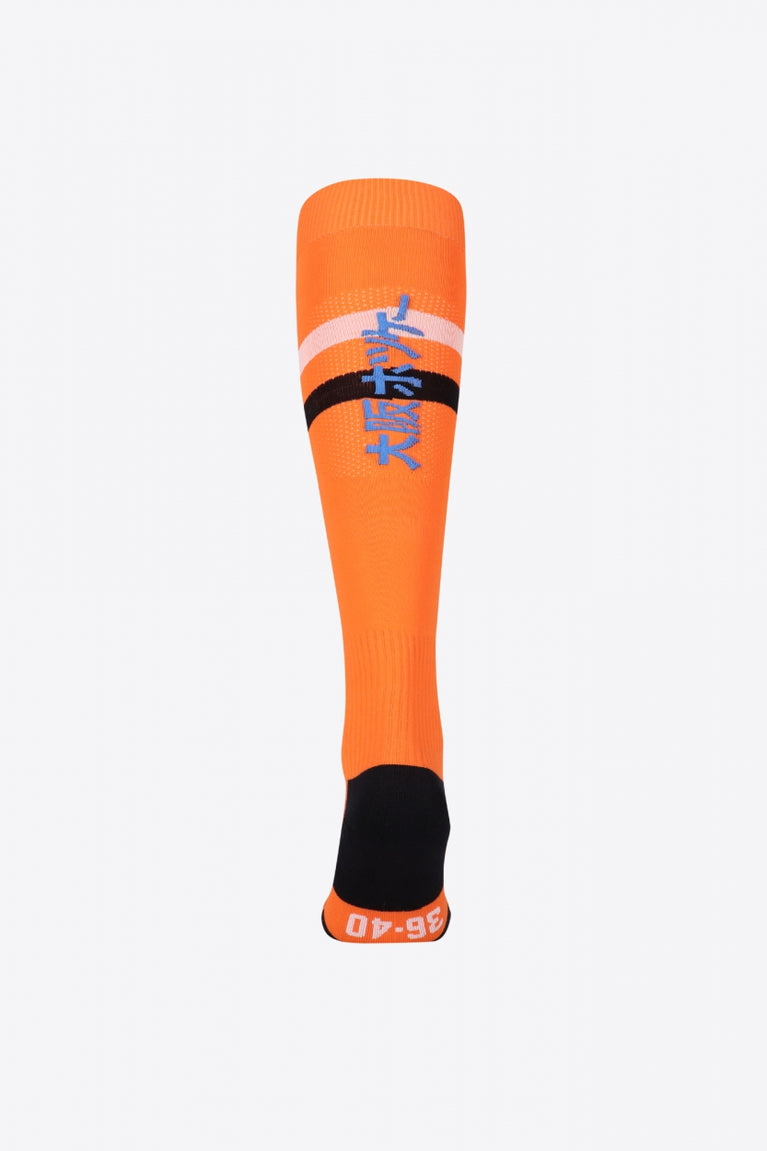 Iluro Field Hockey Socks in orange with Osaka logo in green. Back view