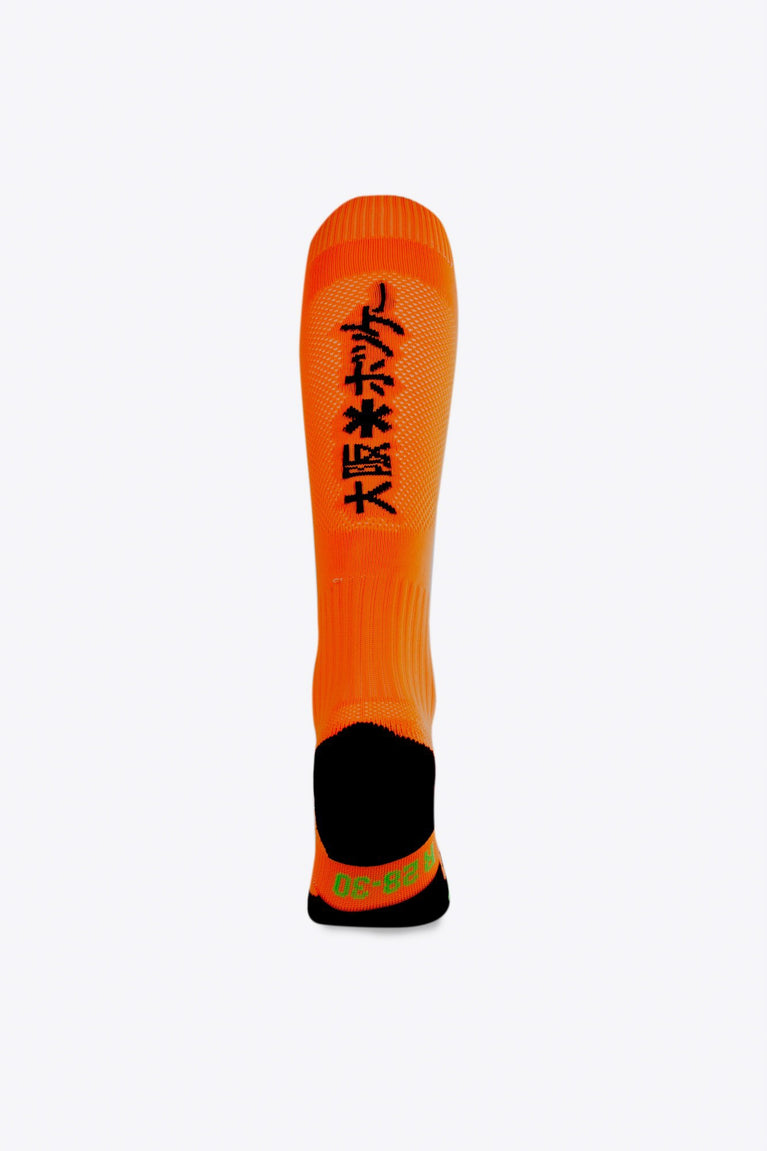 Osaka Field Hockey Socks in orange with Osaka logo in green. Back view