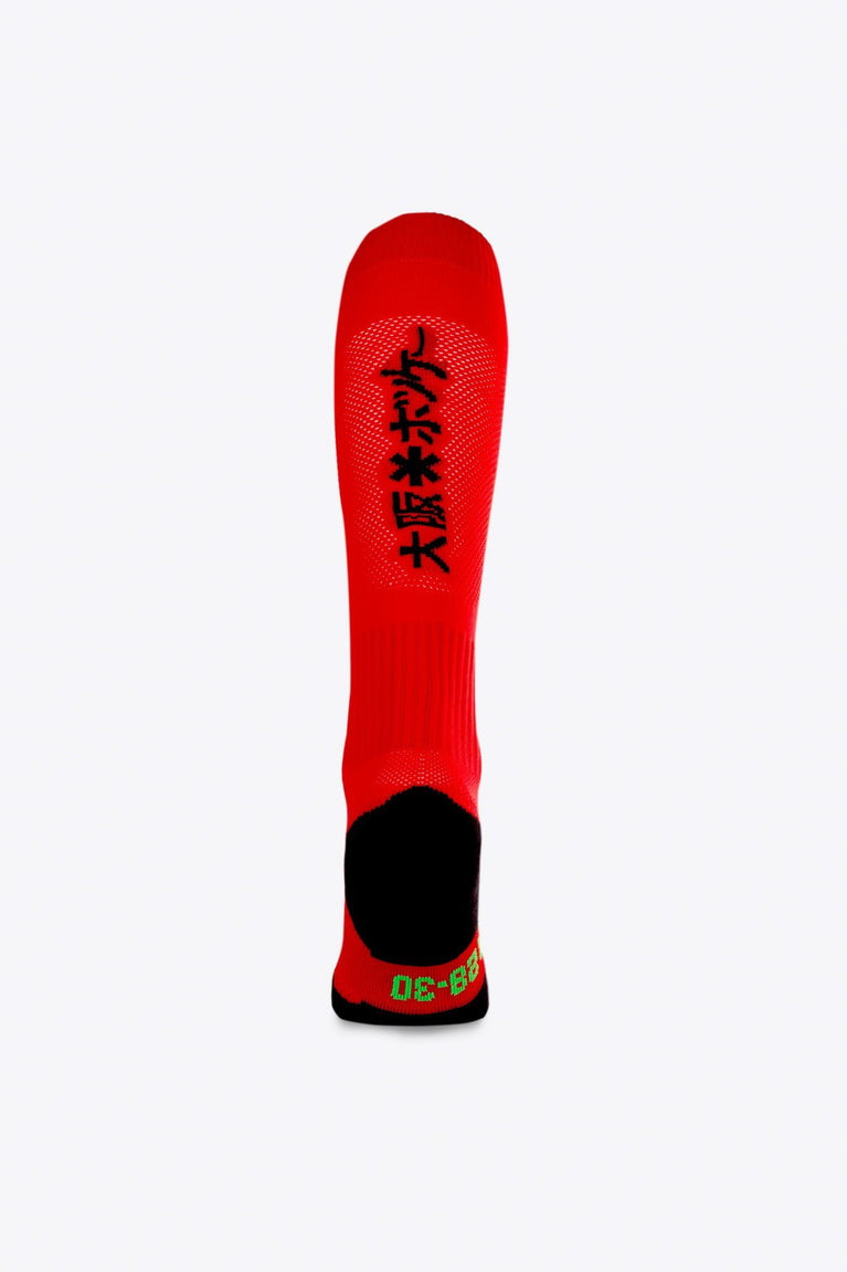 Osaka Field Hockey Socks in red with Osaka logo in green. Back view
