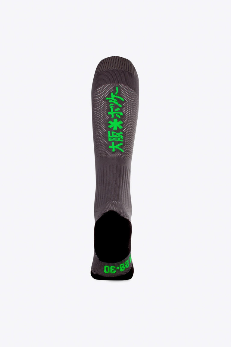 Osaka Field Hockey Socks in grey with Osaka logo in green. Back view