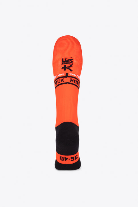 Osaka Field Hockey Socks in moon orange with Osaka logo in white. Front view