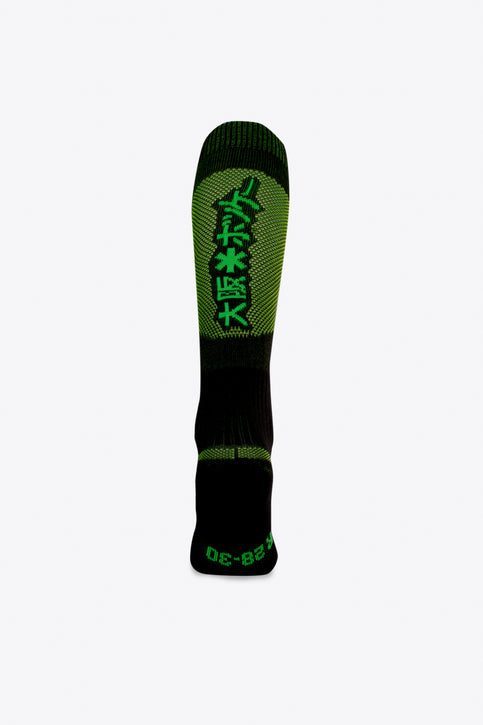 Osaka Field Hockey Socks black-yellow melange with Osaka logo in green. Front view