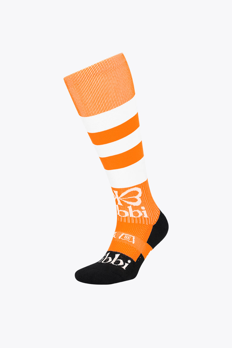 Orange field hockey crew socks with white stripes and black toe and heel