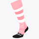 Pastel pink field hockey socks with white stripes and black toe