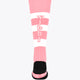 Pastel pink field hockey socks with white bands and Yibbi logo at cuff