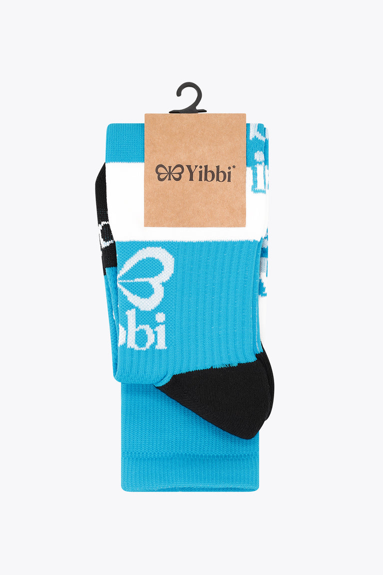 Yibbi light blue field hockey socks on retail package with black heel/toe