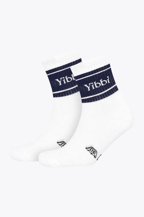 Pair of Yibbi navy-and-white sport socks with striped cuff and logo at ankle