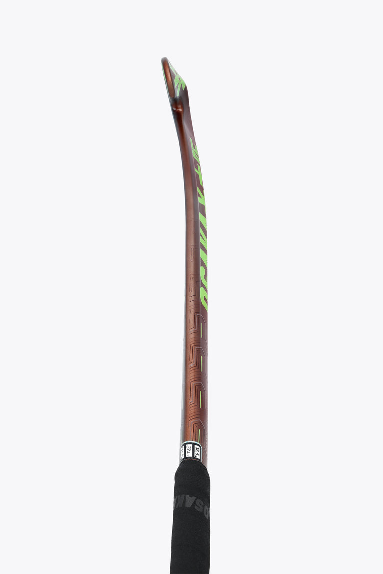 Brown field hockey stick with green accents and a black grip on the handle.