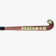 Brown field hockey stick with 'OSAKA' lettering and green star accents along blade.