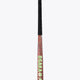 Brown field hockey stick with black butt cap, 'OSAKA' text, and green star decal.