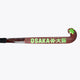 Field hockey stick horizontal view: dark brown shaft with OSAKA text and lime end mark.