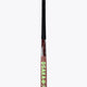 Field hockey stick upright view: dark brown blade with lime cross/star accents and black handle.