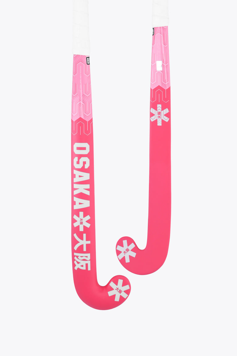 Hot pink field hockey stick with curved low-bow head and Osaka branding