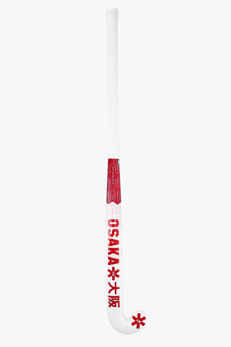 Osaka field hockey stick, white with hot pink OSaka text on curved end.