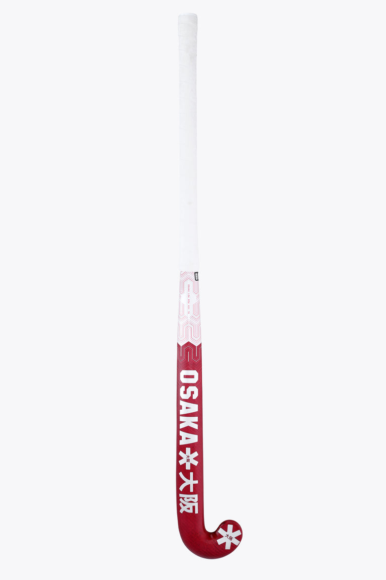 Hot pink field hockey stick handle with OSAKA star logo