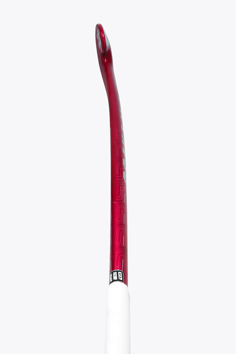 Hot pink field hockey stick shaft with printed graphics and white grip end