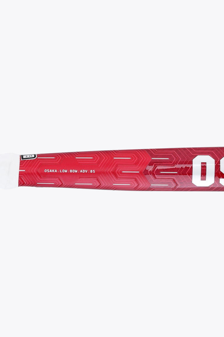 Hot pink field hockey stick shaft with geometric pattern texture and OSAKA lettering
