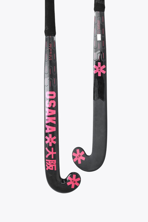 Black field hockey stick with hot pink low-bow head and grip tape