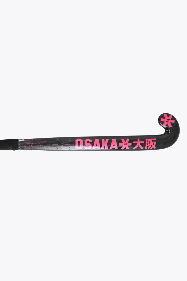 Black field hockey stick with hot pink 'OSAKA' logo on the blade