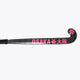 Black field hockey stick with hot pink 'OSAKA' logo on the blade