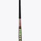 Field hockey stick with OSAKA text on shaft and green star on curved blade, black grip