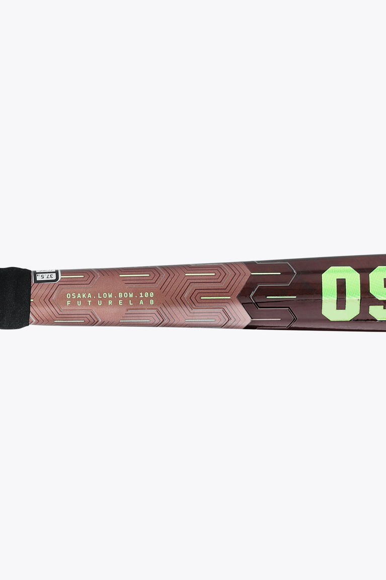 Field hockey stick with green accents, curved low-bow head and black grip