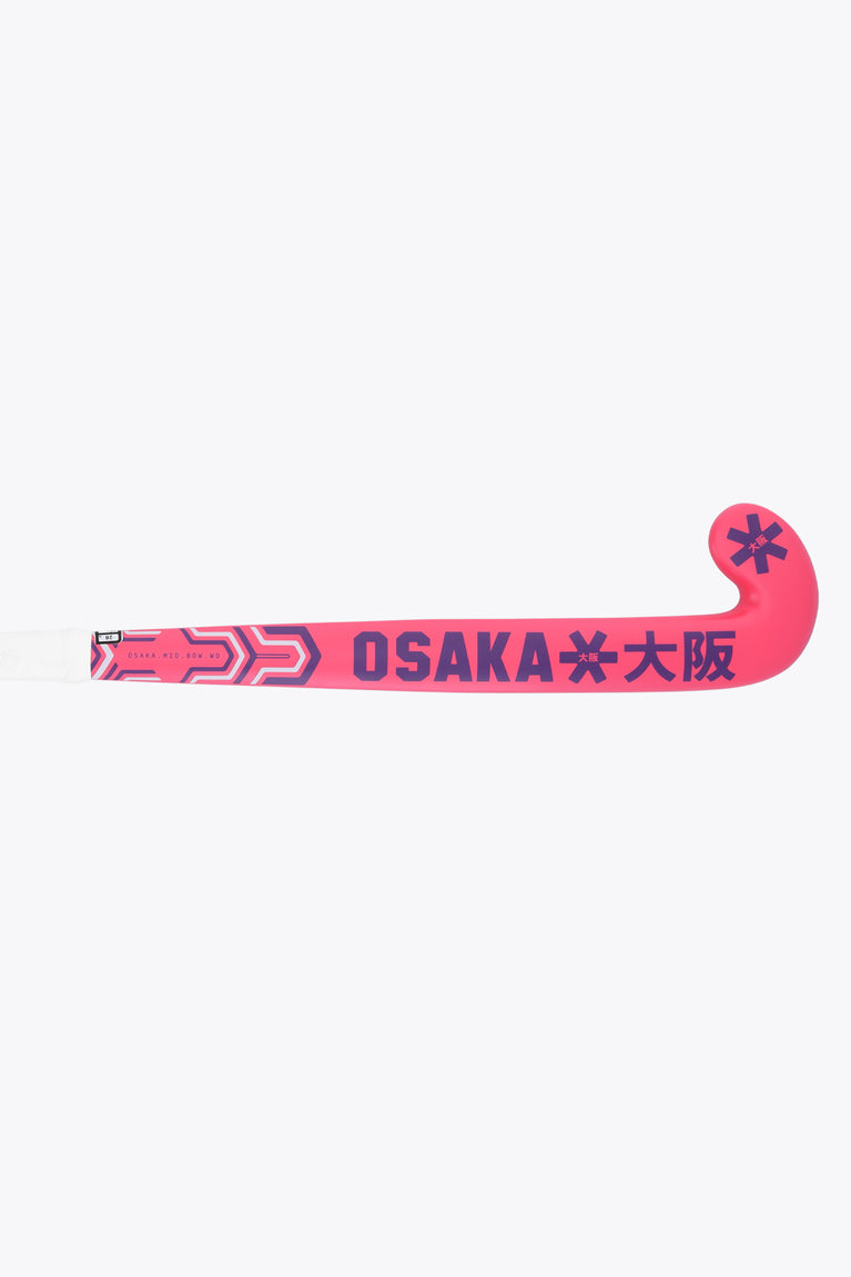 Hot pink field hockey stick showing the full blade with OSAKA text detail