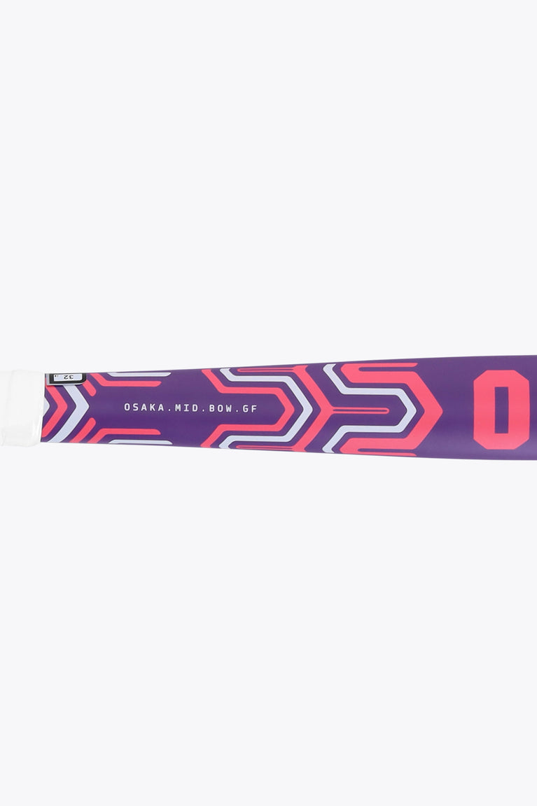 Royal purple hockey stick shaft with red arrow-like pattern and partial lettering.