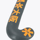 Field hockey stick curved blade, dark gray with large orange logo graphic