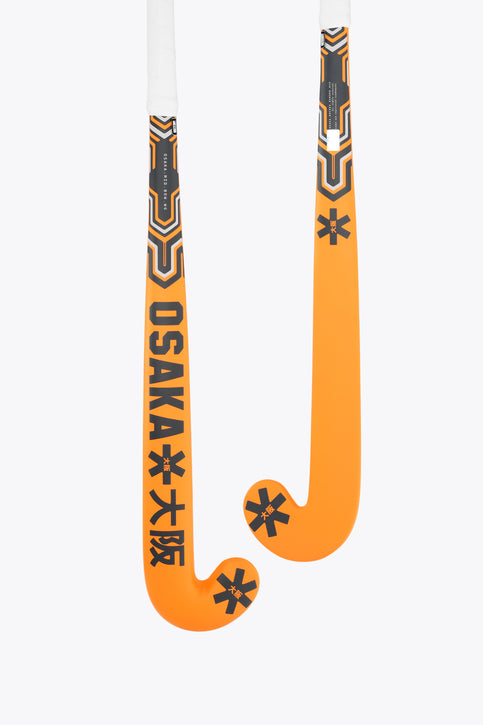 Two orange field hockey sticks showing Osaka logos and black geometric head design