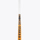 Orange field hockey stick with Osaka lettering on black-and-gold patterned section