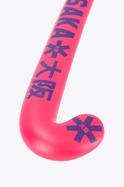 Hot pink Osaka field hockey stick, mid bow, dark graphic accents on head