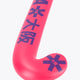 Hot pink Osaka field hockey stick head with dark star-like graphic on curve