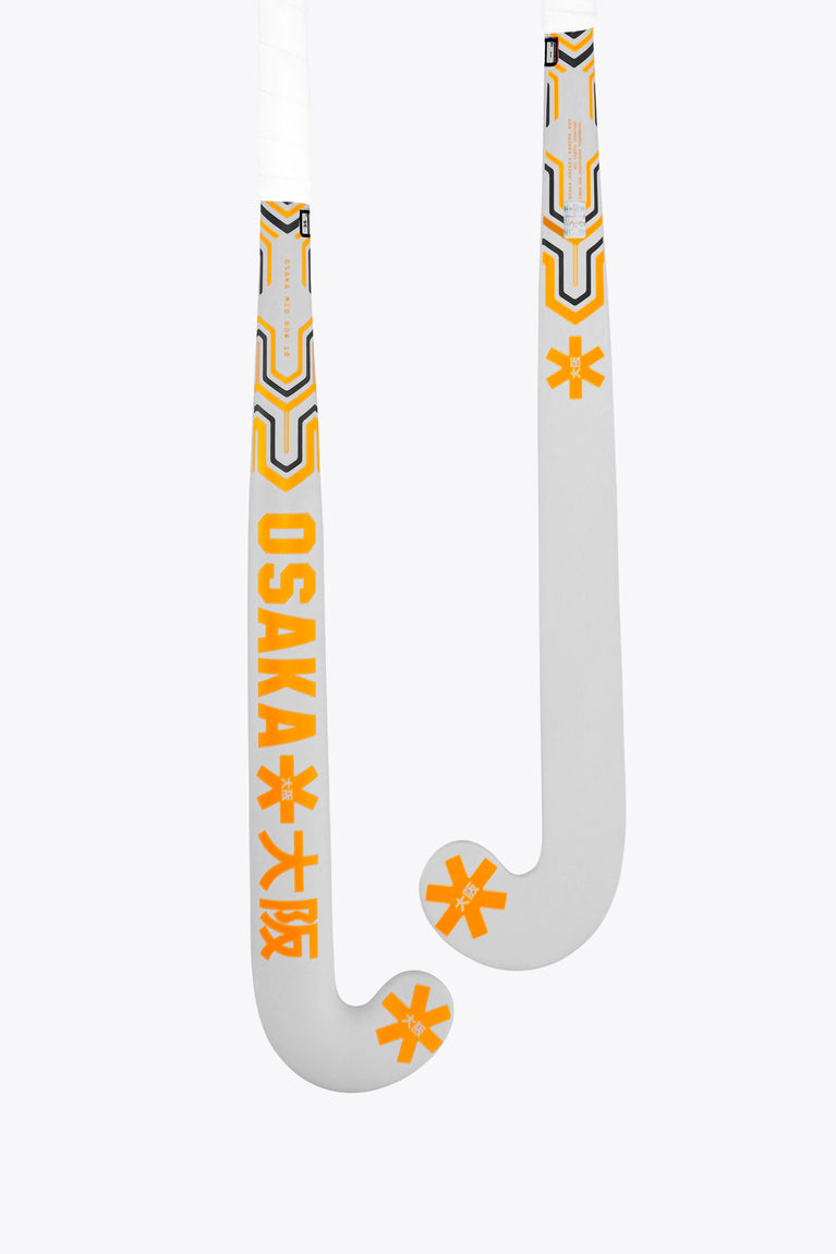 Orange-and-gray Osaka mid-bow field hockey stick, curved head with star graphics