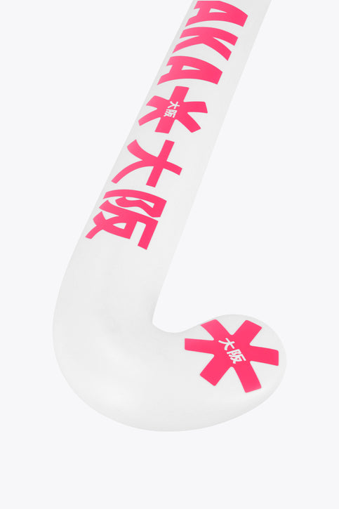 White field hockey stick with hot pink and blue grip decals, showing mid-bow curve