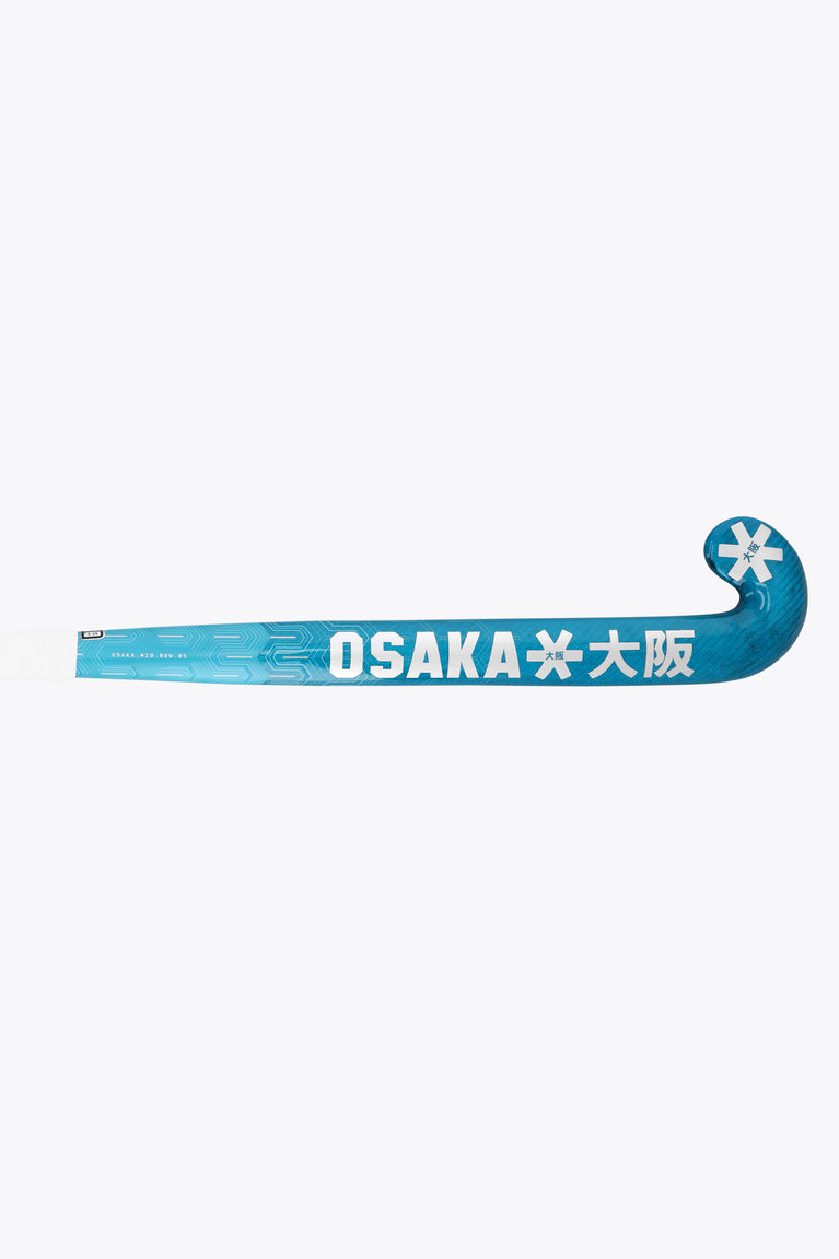 Blue field hockey stick blade with OSKAKA lettering and end-cap snowflake logo