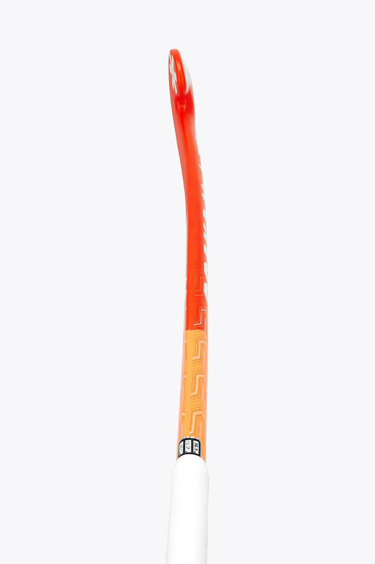 Orange field hockey stick with white grip tape at the handle end