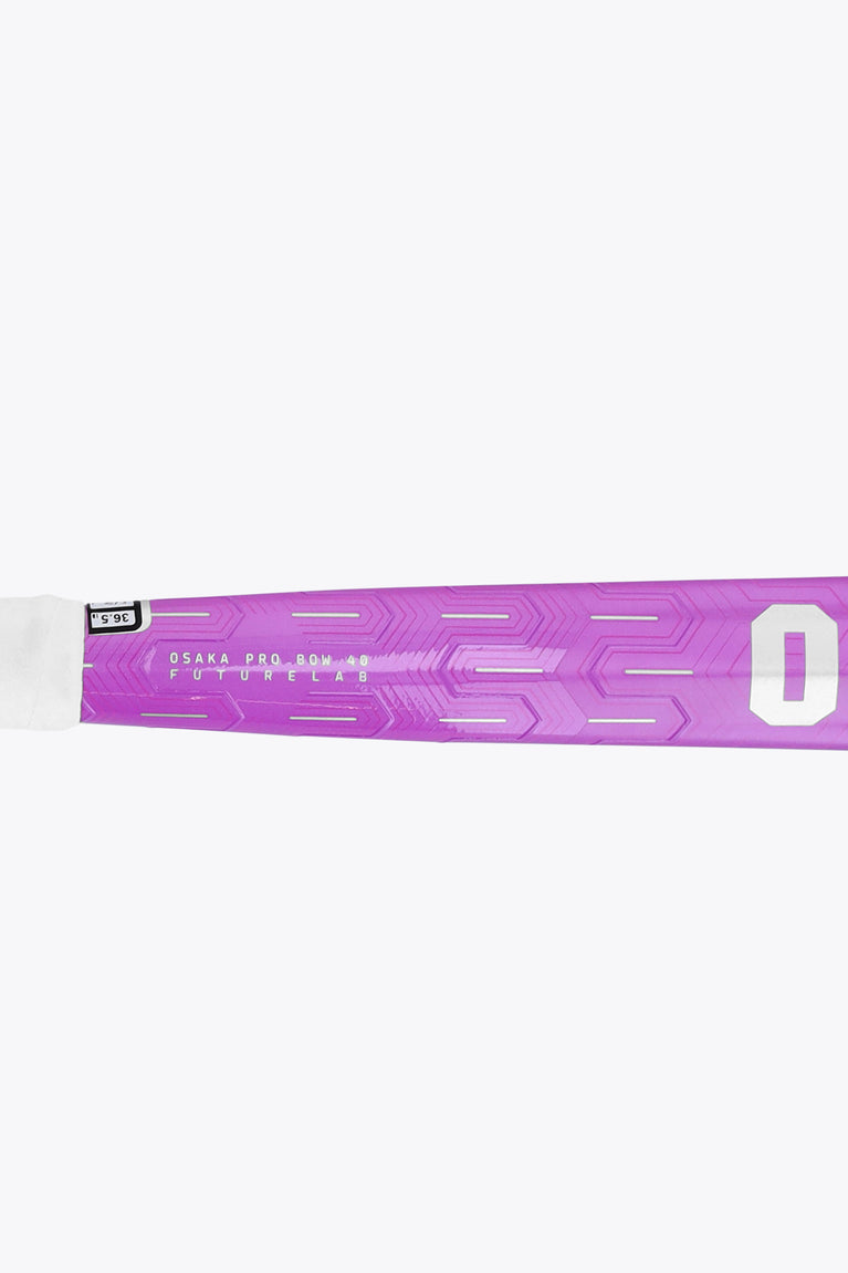 Purple field hockey stick shaft end with OSaka Pro markings and number 0 design